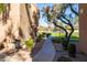 Sidewalk runs along the landscaped grounds and leads to a covered grill area in this convenient community at 8260 E Arabian Trl # 170, Scottsdale, AZ 85258