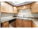 Kitchen featuring stainless steel appliances and wood cabinets at 8260 E Arabian Trl # 170, Scottsdale, AZ 85258