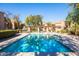 Inviting community pool with clear, blue water has ample lounge seating and access steps to the refreshing water at 8260 E Arabian Trl # 170, Scottsdale, AZ 85258