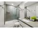 Bathroom featuring a shower over tub with gray subway tile and vanity with modern fixtures at 8307 E Montebello Ave, Scottsdale, AZ 85250