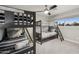 Bedroom featuring two sets of bunkbeds, ceiling fan, and large bright window at 8307 E Montebello Ave, Scottsdale, AZ 85250