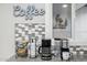 Charming coffee station with decorative tile backsplash and modern appliances at 8307 E Montebello Ave, Scottsdale, AZ 85250