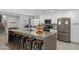 Modern kitchen with an island, breakfast bar, and stainless steel appliances at 8307 E Montebello Ave, Scottsdale, AZ 85250