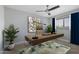 Modern home office featuring a sleek desk, comfortable chair, stylish art and a large window at 8307 E Montebello Ave, Scottsdale, AZ 85250