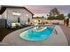 Private backyard oasis featuring a sparkling pool, lounge chairs, and covered patio at 8307 E Montebello Ave, Scottsdale, AZ 85250