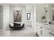 Bright bathroom featuring a vanity with marble countertop, artistic decor, and grey settee beneath a painting at 8822 E Chino Dr, Scottsdale, AZ 85255