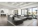 Spacious living room features natural light, a modern fireplace, and hardwood flooring at 8822 E Chino Dr, Scottsdale, AZ 85255