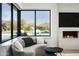 Stylish living room with a corner window offering views of the pool and mountain landscape at 8822 E Chino Dr, Scottsdale, AZ 85255