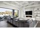 Bright living room with a coffered ceiling, fireplace, and sliding glass doors to the outdoor pool area at 8822 E Chino Dr, Scottsdale, AZ 85255