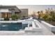 Inviting pool with an integrated spa, fire feature and comfortable patio seating creates a backyard oasis at 8822 E Chino Dr, Scottsdale, AZ 85255