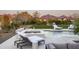 A luxurious pool area featuring a spa, sun loungers, and lush landscaping, perfect for relaxation at 8822 E Chino Dr, Scottsdale, AZ 85255