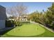 Private putting green in a well-maintained backyard offers a golfer's paradise at 8822 E Chino Dr, Scottsdale, AZ 85255