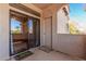 Cozy balcony featuring tile flooring, a sliding glass door, and a convenient outdoor storage closet at 9151 W Greenway Rd # 277, Peoria, AZ 85381