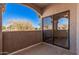 Balcony featuring a sliding glass door and view of mature trees at 9151 W Greenway Rd # 277, Peoria, AZ 85381