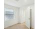 Bedroom with white walls and a window and access to cabinet at 9156 W Garfield St, Tolleson, AZ 85353