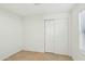 Bedroom featuring a window and closet with sliding doors at 9156 W Garfield St, Tolleson, AZ 85353