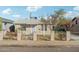 Welcoming single-story home with a fenced yard, desert landscaping, and a charming entryway at 9156 W Garfield St, Tolleson, AZ 85353