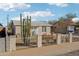 Charming single-story home with a desert-friendly landscaped front yard enclosed by a decorative wrought iron fence at 9156 W Garfield St, Tolleson, AZ 85353