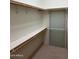 Walk-in closet featuring shelving and hanging rods for optimal storage at 970 W Diamond Rim Dr, Casa Grande, AZ 85122