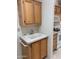 Utility sink in laundry area featuring neutral-toned cabinets at 970 W Diamond Rim Dr, Casa Grande, AZ 85122