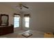 Main bedroom featuring neutral carpet, a ceiling fan, and a dresser at 970 W Diamond Rim Dr, Casa Grande, AZ 85122