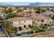 Amazing backyard featuring a sparkling pool, lush palm trees and mountain views at 9765 E Lompoc Ave, Mesa, AZ 85209