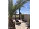 A stone-lined fire pit and paver patio make this backyard great for entertaining at 9765 E Lompoc Ave, Mesa, AZ 85209