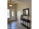 Inviting foyer showcasing tile flooring, elegant lighting, and a decorative console table at 9765 E Lompoc Ave, Mesa, AZ 85209