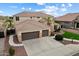 Beautiful two-story home boasting a three-car garage and meticulously maintained landscaping at 9765 E Lompoc Ave, Mesa, AZ 85209