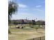 View of the golf course and neighborhood beyond the wrought iron fence at 9765 E Lompoc Ave, Mesa, AZ 85209