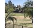 View of the golf course and neighborhood beyond the wrought iron fence at 9765 E Lompoc Ave, Mesa, AZ 85209