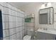 A well-lit bathroom with a shower-tub combination, shelf, and sleek white vanity at 9853 E Birchwood Ave, Mesa, AZ 85208