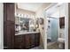 Well-maintained bathroom featuring a granite vanity, shower stall, and modern fixtures at 1056 S 79Th St, Mesa, AZ 85208