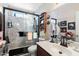 Well-lit bathroom with marble shower, glass doors, and neutral-toned walls at 1056 S 79Th St, Mesa, AZ 85208