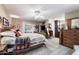 Cozy bedroom featuring wood accents, a window seat, and plenty of natural light at 1056 S 79Th St, Mesa, AZ 85208