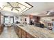 Modern kitchen showcasing granite countertops and seamlessly connecting to the dining area at 1056 S 79Th St, Mesa, AZ 85208