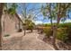 Desert landscaped backyard featuring gravel, mature trees and shrubs, providing a serene outdoor space at 1148 S Sierra St, Gilbert, AZ 85296