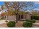 Charming single-story home with a well-maintained front yard, a two-car garage and desert landscaping at 1148 S Sierra St, Gilbert, AZ 85296