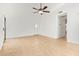 Spacious living room featuring tile flooring, ceiling fan and bright white walls at 1148 S Sierra St, Gilbert, AZ 85296