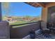 Scenic balcony with seating offers a serene space to enjoy the view of the mountains, golf course and well-kept lawns at 11500 E Cochise Dr # 2088, Scottsdale, AZ 85259