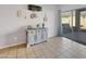 Cozy dining area with stylish furnishings, tile flooring, and sliding glass doors to the backyard at 12017 N 151St Dr, Surprise, AZ 85379