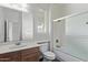 This bathroom boasts a tiled shower and tub, framed mirror, and light wood vanity at 12132 W Ashby Dr, Peoria, AZ 85383