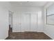 The bedroom includes neutral carpet, a closet with sliding doors, and large bright window at 12132 W Ashby Dr, Peoria, AZ 85383