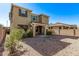 Charming two-story home with a welcoming front porch and desert landscaping at 12132 W Ashby Dr, Peoria, AZ 85383