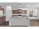 Spacious kitchen featuring a central island, modern appliances, and ample cabinet space for storage at 12132 W Ashby Dr, Peoria, AZ 85383