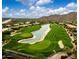 Scenic aerial view of a golf course, pond, and surrounding lush landscaping at 12946 N 116 St # 24, Scottsdale, AZ 85259