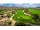 Aerial view of a golf course community with lush greenery and mountain views at 12946 N 116 St # 24, Scottsdale, AZ 85259