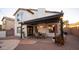 Charming covered patio with stylish dining table, chairs, and potted plants, creating a cozy outdoor dining space at 13451 S 47Th Way, Phoenix, AZ 85044