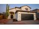 Charming two-story home with a well-kept front yard and a two-car garage at 13451 S 47Th Way, Phoenix, AZ 85044