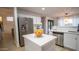 Modern kitchen featuring white cabinets, stainless steel appliances, and a practical center island at 13451 S 47Th Way, Phoenix, AZ 85044